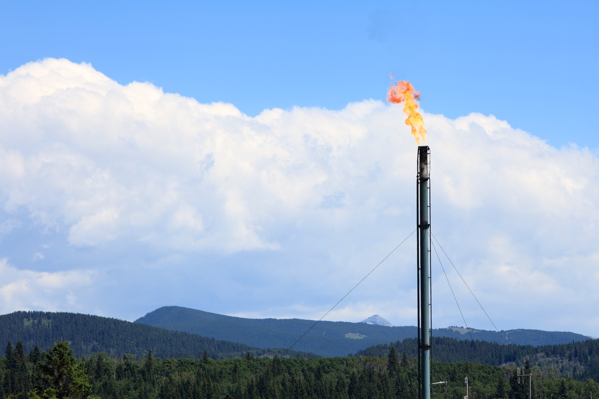 Industrial Gas Plant Flare In The Landscape